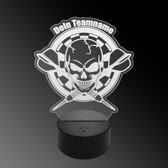 Das Bild zeigt eine LED-Lampe mit einem Plexiglas-Aufsatz in Form eines Totenkopfs vor einer Dartscheibe mit zwei gekreuzten Dartpfeilen. Oben steht der Schriftzug "Dein Teamname".